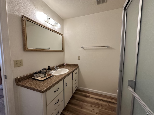 2240 S Elks Ln # 21, Yuma, AZ 85364 - bathroom featuring wood finished floors, vanity, and baseboards