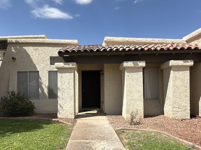 2240 S Elks Ln # 21, Yuma, AZ 85364 - property entrance featuring a tile roof and stucco siding