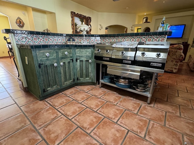 kitchen with tile counters and light tile patterned flooring