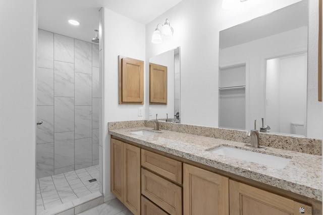 10849 E 45th Pl, Yuma, AZ 85367 - bathroom with a stall shower, double vanity, marble finish flooring, and recessed lighting
