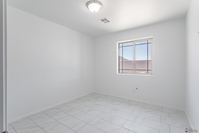 10849 E 45th Pl, Yuma, AZ 85367 - unfurnished room with light marble finish floors