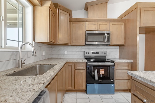 10849 E 45th Pl, Yuma, AZ 85367 - kitchen featuring electric range, stainless steel microwave, light brown cabinets, and tasteful backsplash