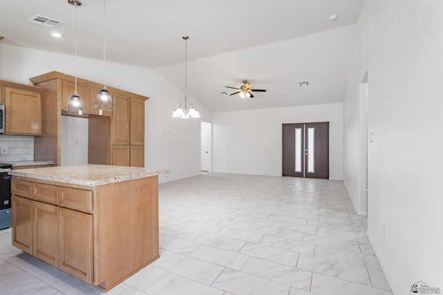 10849 E 45th Pl, Yuma, AZ 85367 - kitchen featuring vaulted ceiling, a chandelier, a ceiling fan, light marble finish floors, and hanging light fixtures