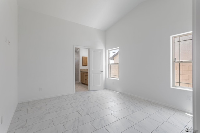 10849 E 45th Pl, Yuma, AZ 85367 - spare room with high vaulted ceiling and light marble finish flooring