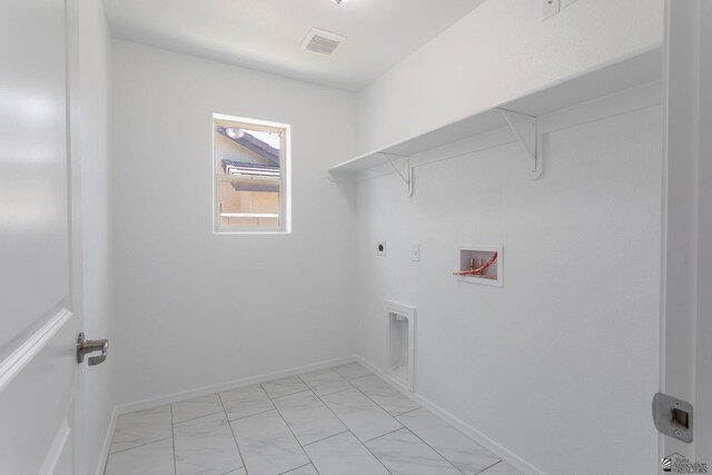 10849 E 45th Pl, Yuma, AZ 85367 - washroom with hookup for a washing machine, electric dryer hookup, and light marble finish flooring