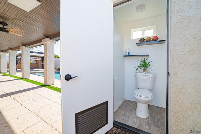 1790 S Meadowbrook Ave, Yuma, AZ 85364 - bathroom with baseboards, a ceiling fan, and toilet