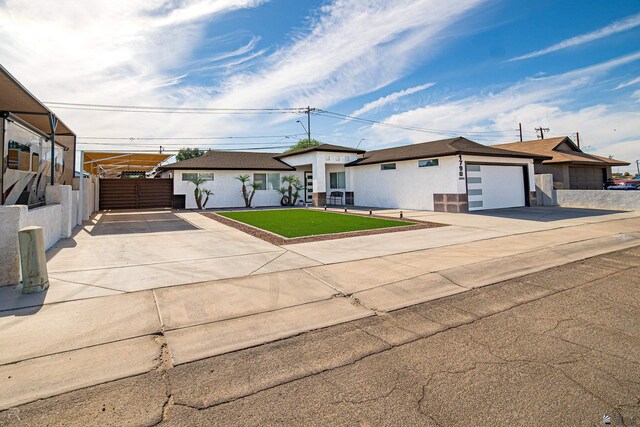 1790 S Meadowbrook Ave, Yuma, AZ 85364 - ranch-style home featuring a garage, fence, a front yard, stucco siding, and concrete driveway