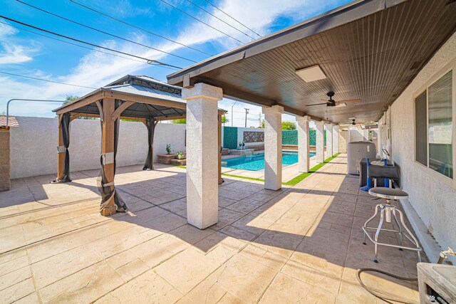 1790 S Meadowbrook Ave, Yuma, AZ 85364 - view of patio featuring a gazebo, a fenced backyard, a ceiling fan, and a fenced in pool