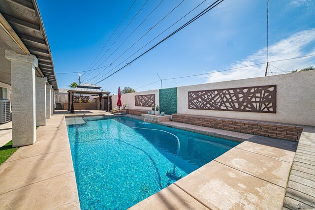 1790 S Meadowbrook Ave, Yuma, AZ 85364 - view of swimming pool featuring a gazebo, a fenced backyard, a fenced in pool, central air condition unit, and a patio