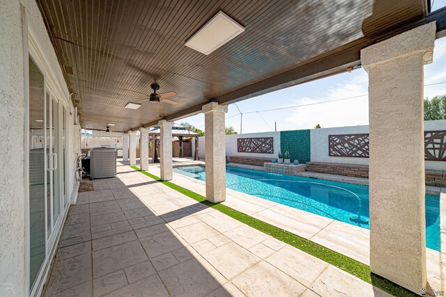 1790 S Meadowbrook Ave, Yuma, AZ 85364 - view of swimming pool featuring a fenced backyard, a fenced in pool, a ceiling fan, central AC unit, and a patio area