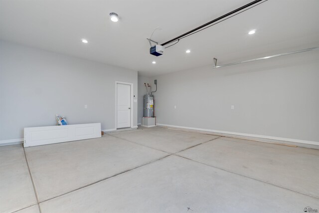 3539 S Akers Way, Yuma, AZ 85365 - garage featuring recessed lighting, baseboards, a garage door opener, and water heater