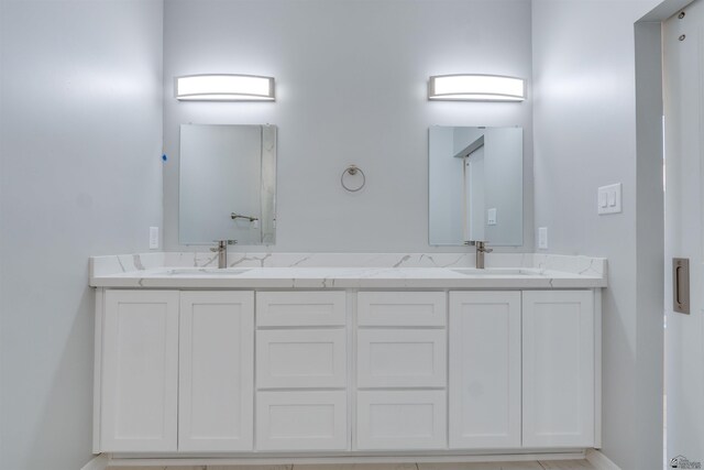 3539 S Akers Way, Yuma, AZ 85365 - bathroom featuring double vanity, baseboards, and a sink