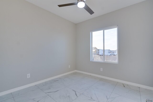 3539 S Akers Way, Yuma, AZ 85365 - unfurnished room with baseboards, marble finish floor, and ceiling fan