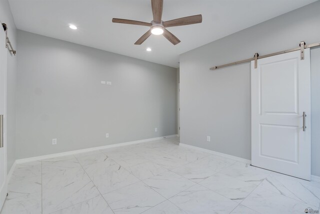 3539 S Akers Way, Yuma, AZ 85365 - empty room with ceiling fan, a barn door, and marble finish floor