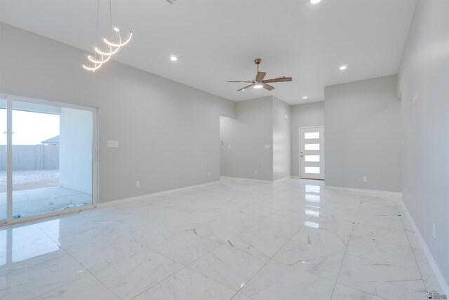 3539 S Akers Way, Yuma, AZ 85365 - unfurnished room with recessed lighting, baseboards, marble finish floor, and ceiling fan with notable chandelier