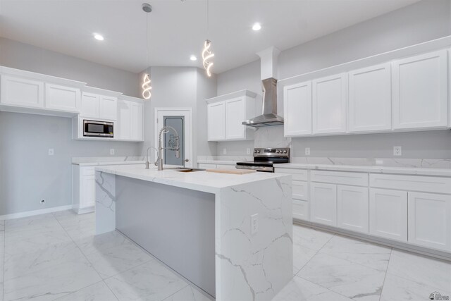 3539 S Akers Way, Yuma, AZ 85365 - kitchen featuring wall chimney range hood, white cabinets, appliances with stainless steel finishes, a sink, and marble finish floor