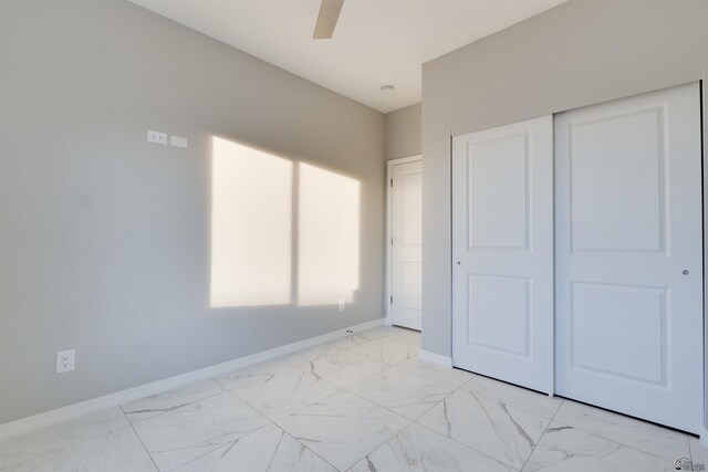 3539 S Akers Way, Yuma, AZ 85365 - unfurnished bedroom with baseboards, ceiling fan, marble finish floor, and a closet