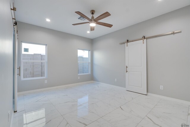 3539 S Akers Way, Yuma, AZ 85365 - spare room featuring visible vents, marble finish floor, recessed lighting, a barn door, and a ceiling fan