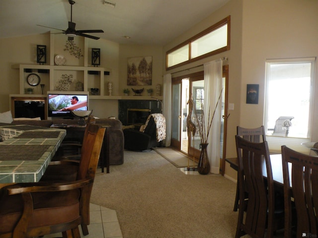 10224 S Fairway Ln, Yuma, AZ 85367 - carpeted dining space featuring a premium fireplace and ceiling fan