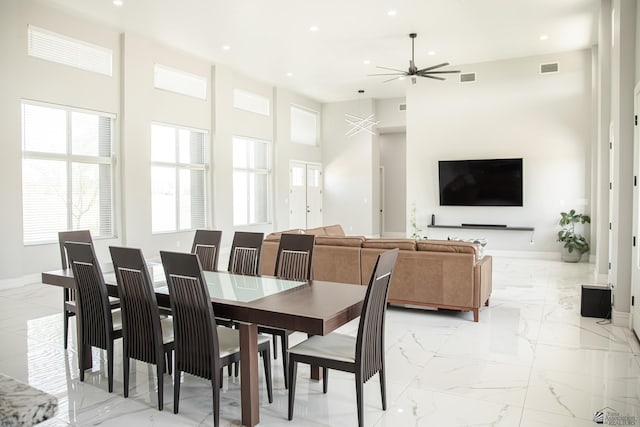 12815 S Greenview Way Greenview Way, Yuma, AZ 85365 - dining room featuring light marble finish floors, ceiling fan, recessed lighting, and a high ceiling