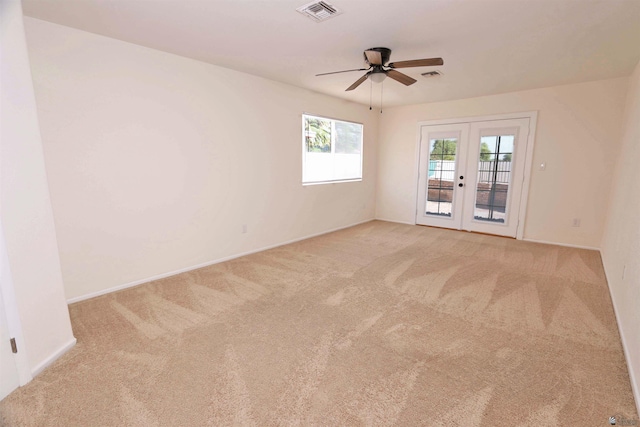3120 W 16th Pl, Yuma, AZ 85364 - empty room with french doors, carpet, and ceiling fan