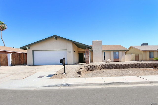 3120 W 16th Pl, Yuma, AZ 85364 - single story home with stucco siding, a garage, and concrete driveway