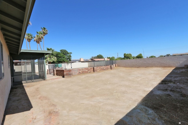 3120 W 16th Pl, Yuma, AZ 85364 - fenced backyard featuring a sunroom