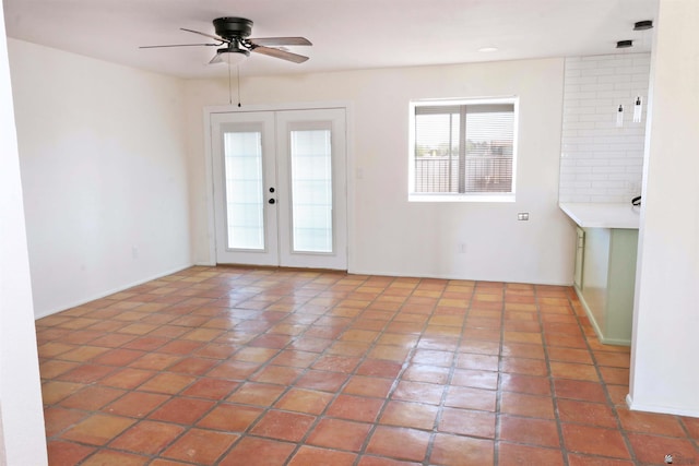 3120 W 16th Pl, Yuma, AZ 85364 - tiled empty room featuring a ceiling fan and french doors