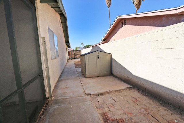 3120 W 16th Pl, Yuma, AZ 85364 - fenced backyard with a storage unit and a patio area