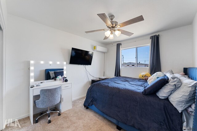 2605 S Nogales Ave, Yuma, AZ 85364 - bedroom featuring a wall unit AC, light carpet, a desk, and a ceiling fan
