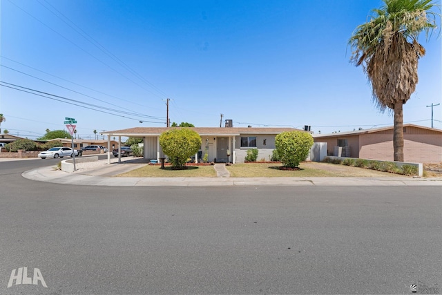 2605 S Nogales Ave, Yuma, AZ 85364 - ranch-style house featuring a carport and driveway