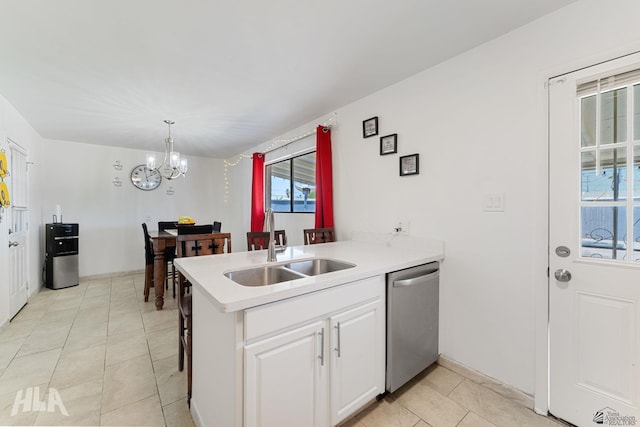 2605 S Nogales Ave, Yuma, AZ 85364 - kitchen with dishwasher, a chandelier, white cabinets, light countertops, and light tile patterned floors