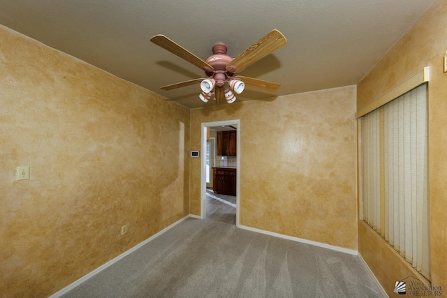 12510 E Del Rico, Yuma, AZ 85367 - unfurnished room with baseboards, ceiling fan, and carpet flooring