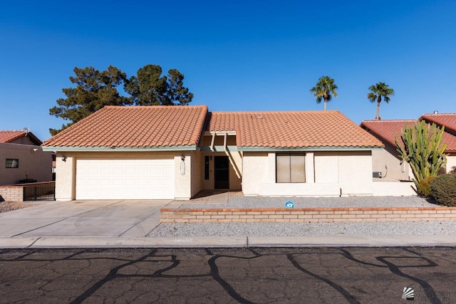 12510 E Del Rico, Yuma, AZ 85367 - ranch-style house with an attached garage, stucco siding, a tile roof, and concrete driveway