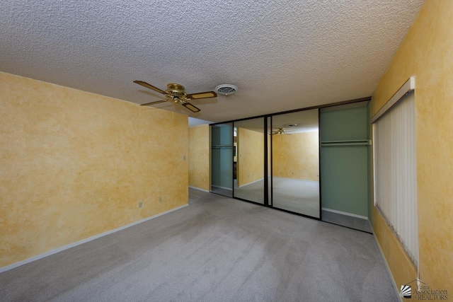 12510 E Del Rico, Yuma, AZ 85367 - unfurnished bedroom with carpet floors, a textured ceiling, visible vents, and baseboards