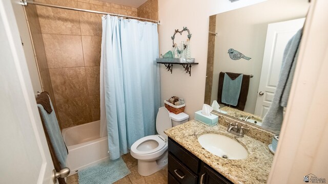 bathroom featuring vanity, tile patterned flooring, shower / bath combo, and toilet