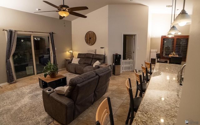 11681 E 36th St, Yuma, AZ 85367 - living area with light tile patterned floors, high vaulted ceiling, visible vents, and ceiling fan