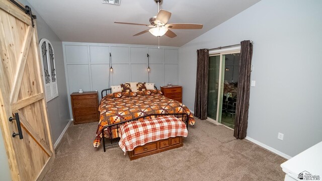 bedroom with baseboards, a barn door, carpet, and access to exterior