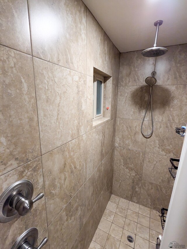 full bath with a tile shower