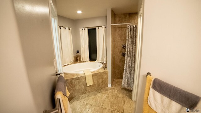 bathroom with tile patterned flooring, a garden tub, recessed lighting, and tiled shower