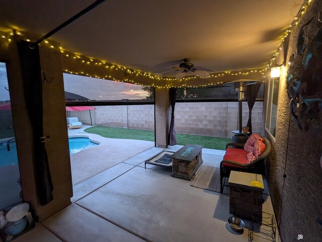 view of patio / terrace with a fenced in pool, a ceiling fan, and a fenced backyard