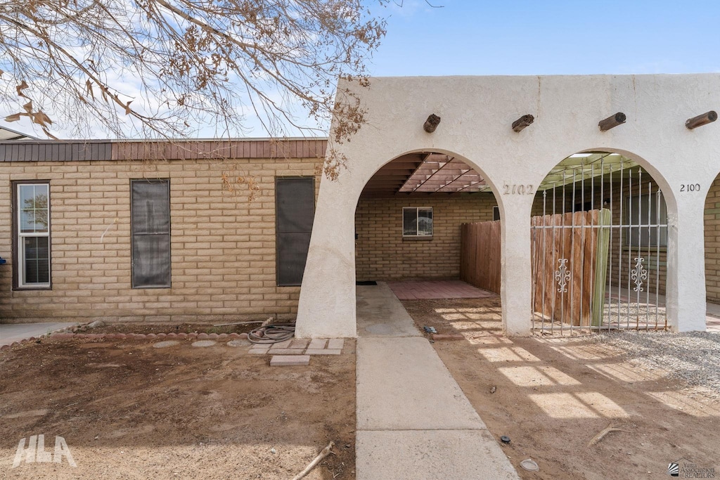 2102 S 11th Ave, Yuma, AZ 85364 - property entrance with brick siding