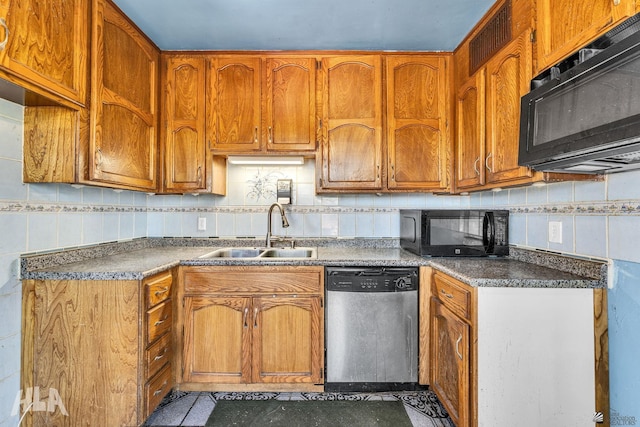 1802 S 11th Ave, Yuma, AZ 85364 - kitchen featuring dishwasher, black microwave, a sink, and brown cabinetry
