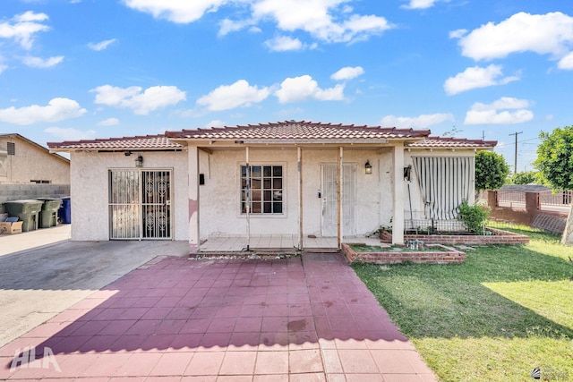 1802 S 11th Ave, Yuma, AZ 85364 - view of front of home featuring a tiled roof, stucco siding, and a patio