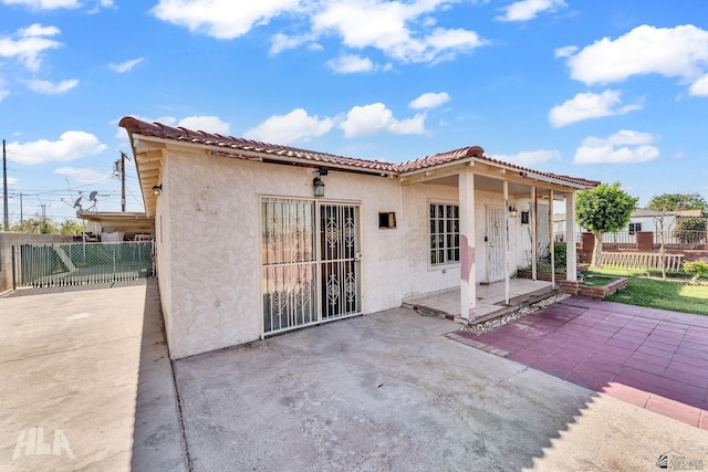 1802 S 11th Ave, Yuma, AZ 85364 - back of house featuring stucco siding, a patio area, and a tiled roof