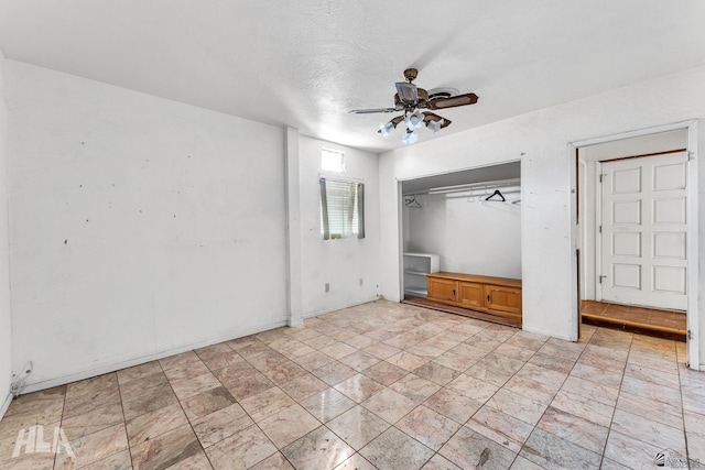 1802 S 11th Ave, Yuma, AZ 85364 - unfurnished bedroom with a closet, ceiling fan, and a textured ceiling