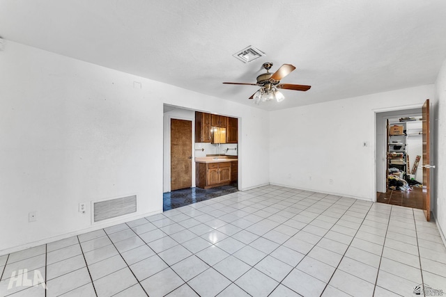 1802 S 11th Ave, Yuma, AZ 85364 - unfurnished living room featuring ceiling fan and light tile patterned flooring