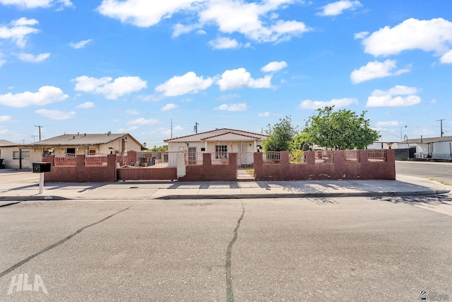 1802 S 11th Ave, Yuma, AZ 85364 - view of front of home with a fenced front yard and a gate