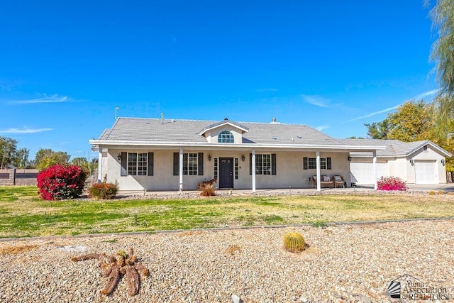 single story home featuring an attached garage, stucco siding, and concrete driveway