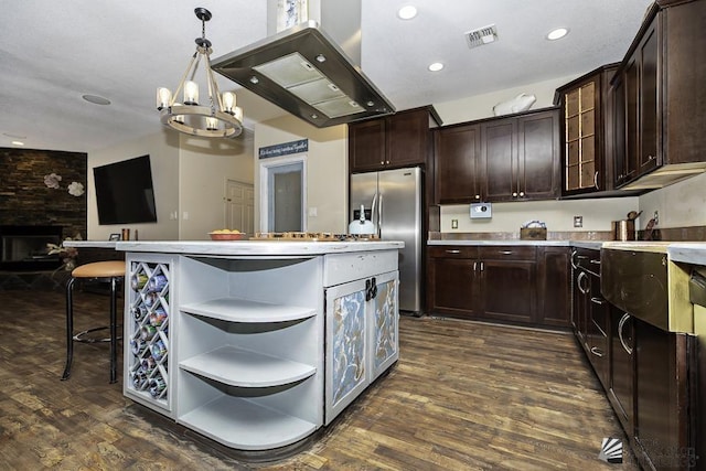 kitchen with freestanding refrigerator, dark wood-style flooring, open shelves, and dark brown cabinets